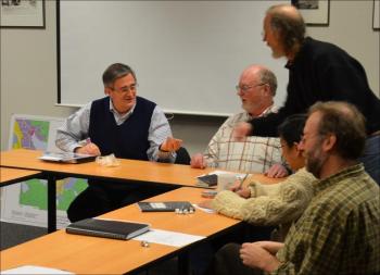 Rockport Select Board member Geoffrey Parker distributes coffee to those gathered.