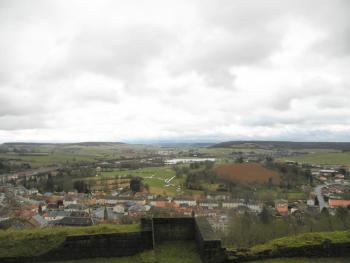 "A gusty French wind sent puffy clouds hustling low across the sky, presumably towards Belgium, and the green fields flowed gently into a wooded horizon."