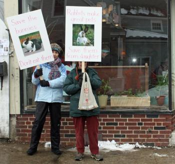 From left, Wendy Andresen and Merrill Tucker picket outside Long Grain restaurant in Camden Saturday afternoon. (Photo by Holly S. Edwards)