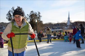 Winterfest brings out the smiles at the Camden Amphitheatre, Jan. 26. Lisa Morgan keeps the rink clean for skaters. (Photo by Lynda Clancy)