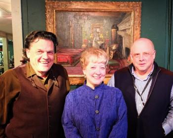 Kaja Veilleux, Carol Achterhof and John Bottero stand in front of Lot #100, "Mrs. Rosen’s Bedroom," an oil on canvas painting by renowned British artist Sir John Lavery (1856-1941) It is expected to bring the highest dollar amount (est. $125,000) in the auction. (Photo by Chris Wolf)
