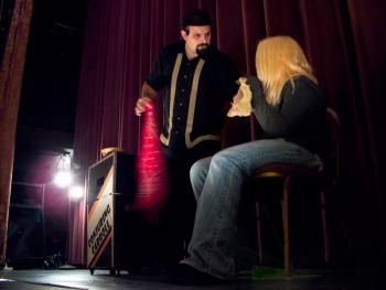 Conjuring Carroll performs magic at the Colonial Theatre with help from Lexi Richard. (Photo by Ethan Andrews) Conjuring Carroll performs a magic trick on stage at the Colonial Theatre with help from Lexi Richard. (Photo by Ethan Andrews)