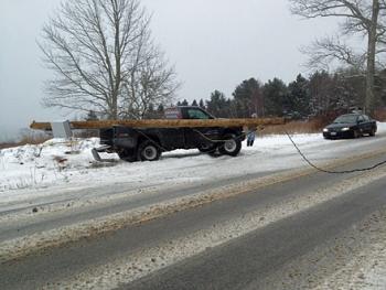 Traffic stops as wires from a downed pole in Lincolville lie across the road Feb. 8. (Photo by David Edwards)