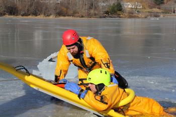 A team on land pulls the line attached to the ring, which then pulls the victim out of the water and onto the rescue sled. (Courtesy Rockland FD/by Alan Athearn)