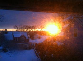 The photo quality is poor, taken on an iPhone through a melting, frosty window, but it illustrates the bright sun that greeted early risers for just a couple of minutes. (Photo by Holly S. Edwards)