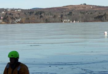 Near the end of Saturday's ice rescue training in Rockland, a flotilla of ice boats raises sails across Chickawaukie Pond. (Photo by Holly S. Edwards)