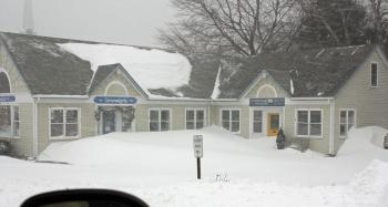 Snow-swamped businesses abound in downtown Camden tonight. (Photo by Holly S. Edwards)