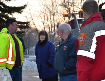 Early Saturday morning, Camden was ready to haul the loader. Tracy Harford, Town Manager Pat Finnigan, and others were on scene by 7 a.m. (Photo by Lynda Clancy)