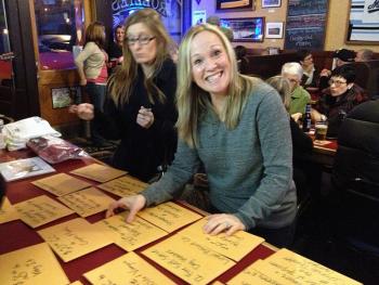 A happy Pints for Paws raffle prize winner.