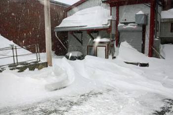 French & Brawn will be busy clearing snow from its delivery entrance Sunday. (Photo by Holly S. Edwards)