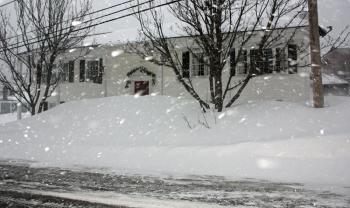 Snow flies in the camera's flash while photographing Paul Gibbons' law office. (Photo by Holly S. Edwards)(Photo by Holly S. Edwards)