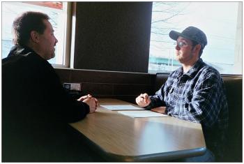 BELFAST - John Jewell of Bangor, left, interviews Trevor Burleigh of Old Town at McDonald's for a commercial trucking job. BELFAST - John Jewell of Bangor, left, interviews Trevor Burleigh of Old Town at McDonald's for an unrelated commercial trucking job. (Photo by Ethan Andrews)