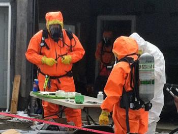 Maine Drug Enforcement agents and others at work Tuesday investigating a suspected methamphetamine laboratory on St. George Road (Route 131) in South Thomaston. A resident, Paul Mahonen, 36, has been arrested and charged with trafficking in drugs. (Courtesy Maine Drug Enforcement Agency)