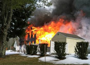 As firefighters rolled down the Vangel's driveway, this is the scene that greeted them. (Photo by Holly S. Edwards)