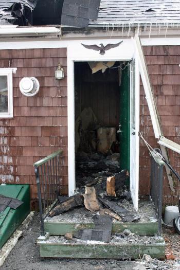 The back of the home sustained the most damage, as it's closest to where the fire originated and burned the longest. (Photo by Holly S. Edwards)