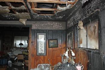 Some of the antiques and other contents being stored inside the home may be salvagable, but a lot won't be, according to Union Fire Chief Barry Norris. (Photo by Holly S. Edwards)