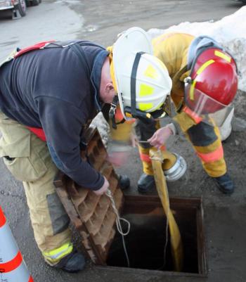 Some cordage tied to the drainage cover and the water line made it a cinch to reconnect it to the hydrant for Sunday night' fire. (Photo by Holly S. Edwards)