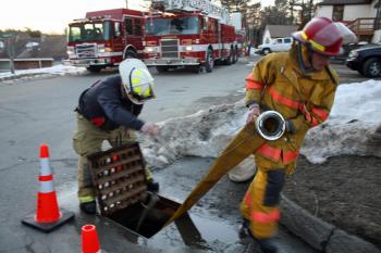 Utilizing the drainage culvert allowed fire trucks and pumpers to use the road without fear of running over a water line. (Photo by Holly S. Edwards)