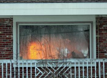 Soon, it was time to light the fire and get the building burning. (Photo by Holly S. Edwards)