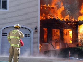 Camden Fire Chief at Tuesday afternoon's house fire on Lily Pond Drive. (Photo by Holly S. Edwards)