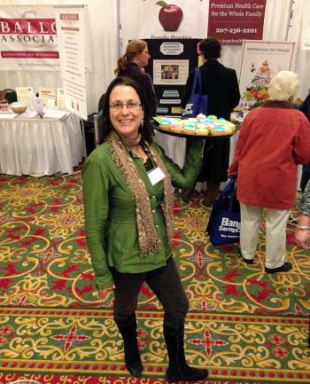 Lynda Clancy is delivering cupcakes to hungry attendees at the Business Expo. (Photo by Holly S. Edwards)