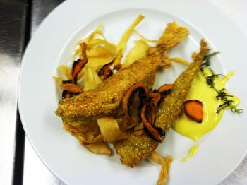 Bacon and cornmeal-fried smelts over carrot and parsnip chips. (Courtesy Ladleah Dunn)