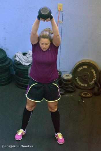Christienne Jones swings the kettlebell. (Photo by Ron Hawkes)