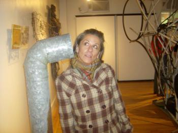 Lisa Diane listens to Bethany Engstrom's "Stand Pipe" installation at the original Resisting Entropy in 2010. (Photo by Kay Stephens)