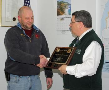 South Thomaston Fire Chief Bryan Calderwood accepts the SHAPE Award from Occupational Safety and Hazard Program Supervisor Mike LaPlante of the Maine Department of Labor. (Photo by Holly S. Edwards)