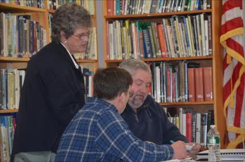Camden First Aid Service Chief Julia Libby talks about her organization's budget with Tim Pearse, chairman of Hope's Board of Selectmen and Selectman Eric Campbell (Photo by Lynda Clancy).