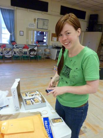 Belfast Free Range Music Festival organizer Meg Fournier working in the American Legion Hall before the event in 2011. (Photo by Kristen Burkholder)