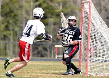 Camden Hills Marshall Spear scores on a hard shot low to the right past the Eagles goalie. (Photo By Ron Hawkes)