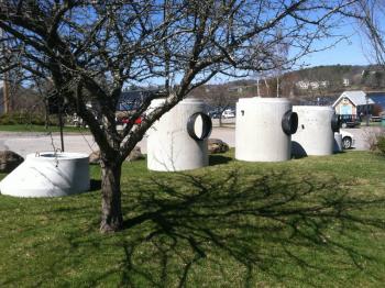 Concrete stormwater drainage components related to the Harbor Walk sit at the edge of Heritage Park. (Photo by Ethan Andrews)