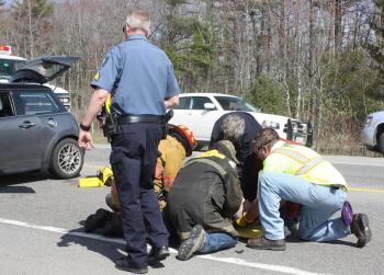 Rescuers work to stabilize and immobilize Thomas Tarbox for transport to Pen Bay Medical Center. (Photo by Holly S. Edwards)