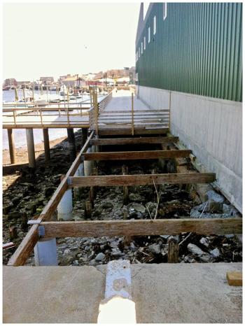 Looking south from the Armistice footbridge toward the mostly-completed boardwalk section of the Harbor Walk. A small connector section remains unfinished. (Photo by Ethan Andrews)