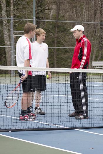 Camden Hills Peter Vannorsdall and Josh Pitcairn listening to advice from coach Walker-Spencer(Photo Courtesy of Dwight Pitcairn)