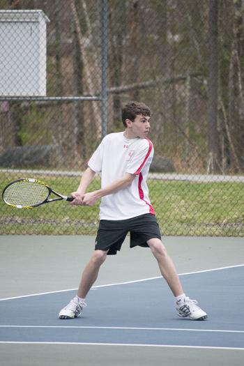 Camden Hills Austin Pohlman about to return a shot in the number 1 singles match (Photo Courtesy of Dwight Pitcairn)