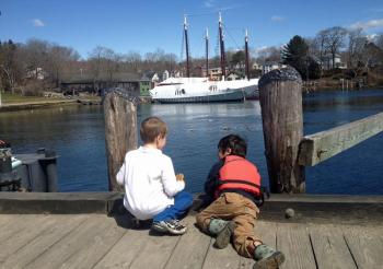 Henry Pixley, son of Camden Harbormaster Steve Pixley, and a friend, James, inspect the seagulls along the harbor's edge. (Courtesy Steve Pixley)
