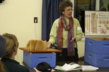 Knox-Lincoln Beekeepers Club member Jane Dunstan is one of a number of honeybee enthusiasts currently teaching nearly 50 new potential beekeepers in the Midcoast at this year's Bee School in Thomaston. (Courtesy John Webster)