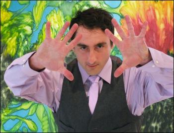 Gigi Aea in front of one of his works. (Photo by Chris Wolf) Gigi Aea