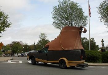 The LL Bean Bootmobile turns onto Atlantic Avenue for a quick stop alongside the Camden Amphitheater and Harbor Park Monday afternoon. (Photo by Holly S. Edwards)