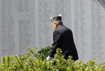 Ray Lewis places a wreath on Camden's Honor Roll during Monday's Memorial Day parade. (Photo by Holly S. Edwards)