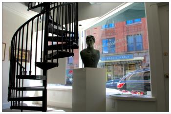 As part of a top-to-bottom renovation of its Belfast headquarters, Maine Farmland Trust added a second floor to its art gallery, accessible by a spiral staircase or the building's new elevator. (Photo by Wes Sterrs)
