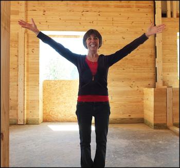 Pepper Hill's first boarder, Iris Beckwith, shows off the spaciousness of her horse's new home.