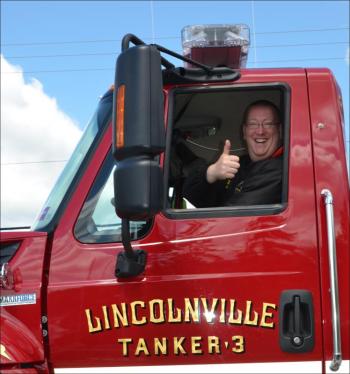 Friends from Lincolnville came to the parade, like Justin Hills, Lincolnville firefighter. (Photo by Lynda Clancy)