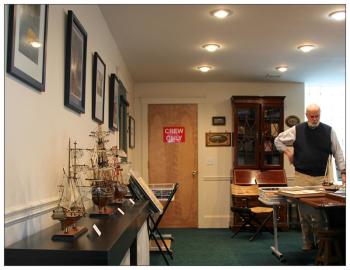 Joe Mosier drew primarily from his own collection for the initial inventory of Nautical Scribe Books, the business he recently opened with his wife Mary. (Photo by Wes Sterrs)