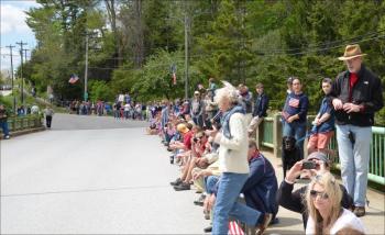 Rockport residents gather to watch the parade on the Goose River Bridge. (Photo by Lynda Clancy)