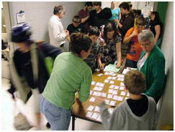 Mount View School students pick up name tags as part of their check in for the Game Loft program. (Photo by Ethan Andrews)