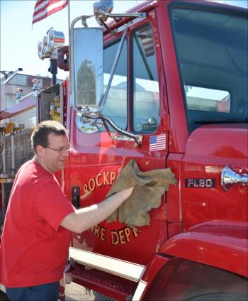 Before the parade, the firetrucks were washed and polished at the Rockport Fire Station. (Photo by Lynda Clancy)