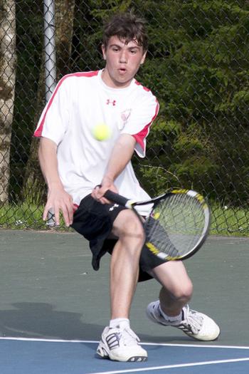 Camden Hills Austin Pohlman returning the ball in the No. 1 singles match which he won. (Photo Courtesy of Dwight Pitcarin)